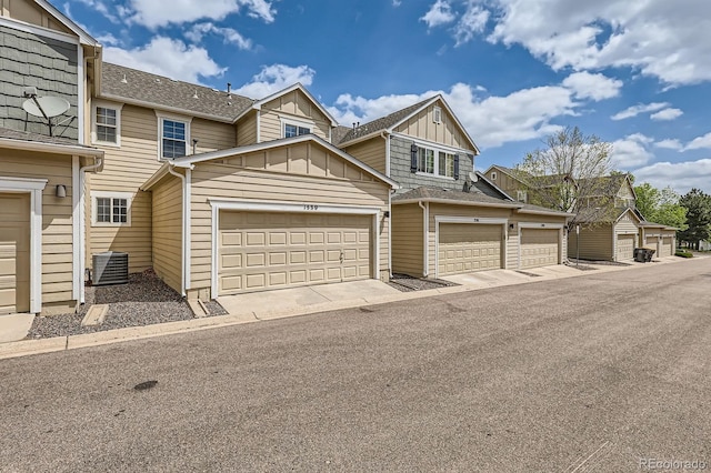 1539 Bennet Mountain Rd, Castle Rock, CO 80109 - townhome / multi-family property featuring board and batten siding, a garage, central AC, and a shingled roof