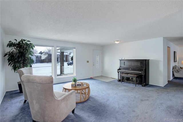 living room with a textured ceiling and dark colored carpet