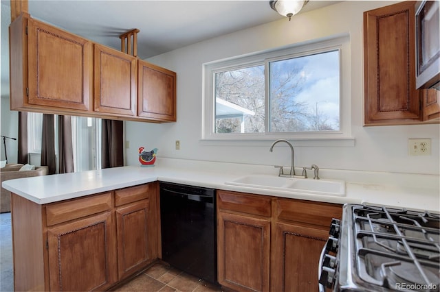 kitchen with dishwasher, sink, range with gas stovetop, and kitchen peninsula