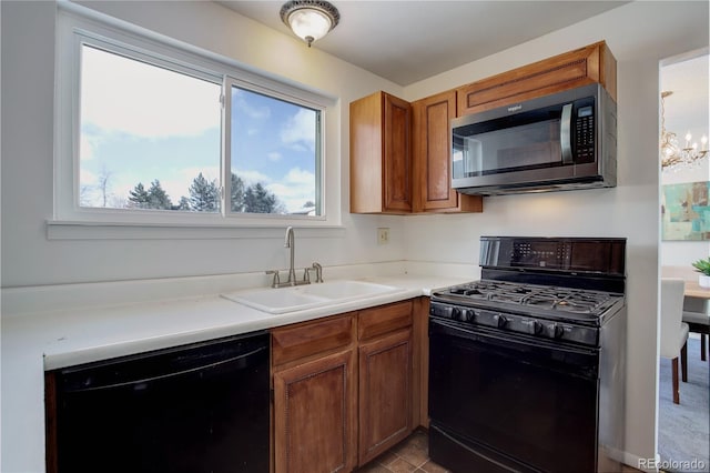 kitchen featuring sink and black appliances