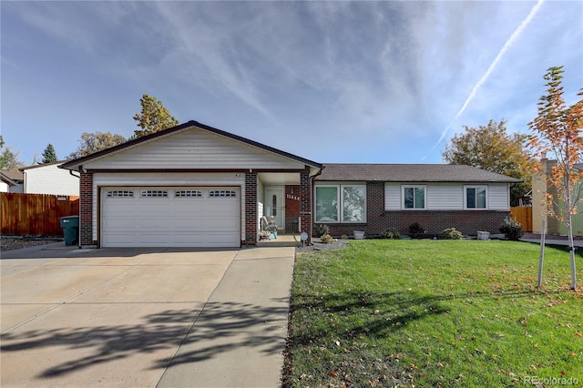 ranch-style home with a garage and a front lawn