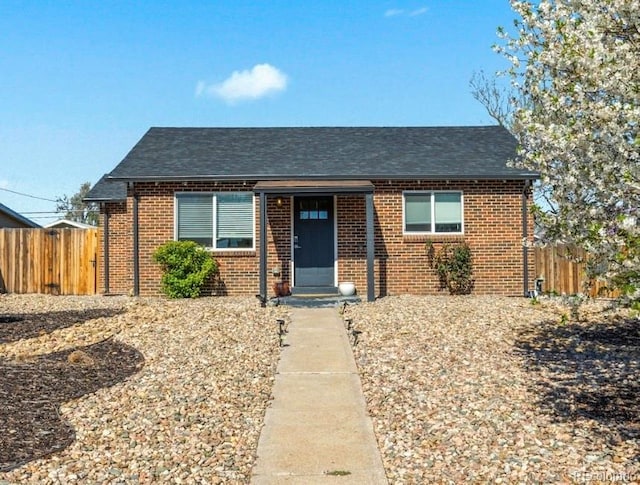 3011 Oneida St, Denver, CO 80207 - view of front of home with brick siding and roof with shingles