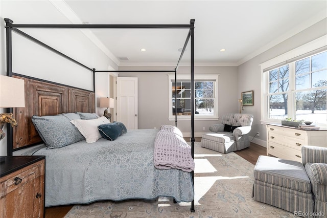 bedroom featuring hardwood / wood-style flooring and crown molding