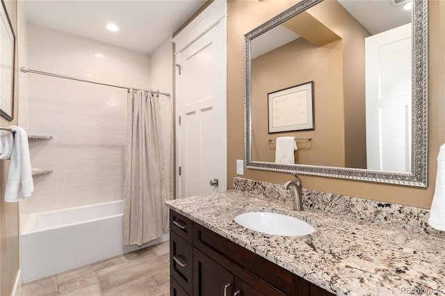 bathroom with shower / bath combination with curtain and vanity