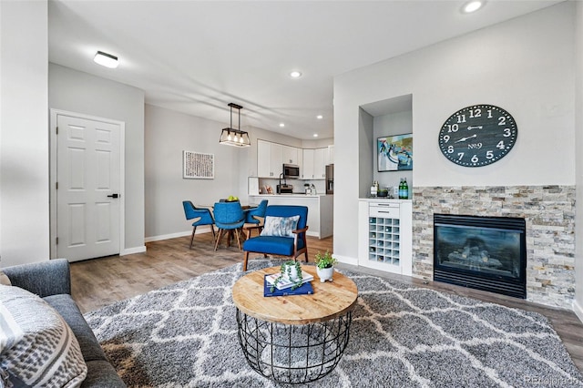 5555 E Briarwood Ave Unit 2604, Centennial, CO 80122 - living room featuring light wood-style flooring and recessed lighting