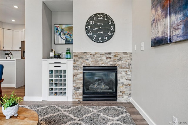 5555 E Briarwood Ave Unit 2604, Centennial, CO 80122 - living area featuring wood finished floors, recessed lighting, and a stone fireplace