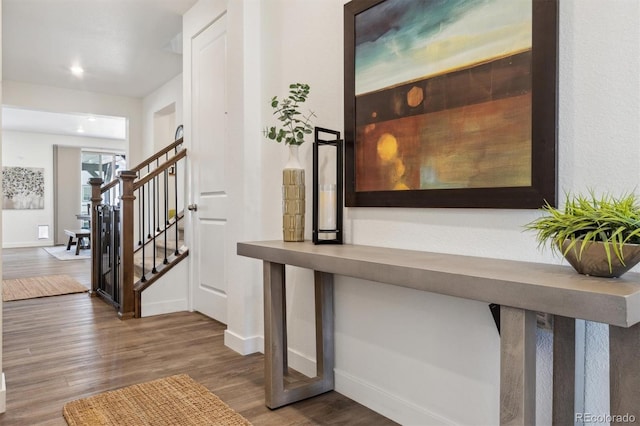 interior space with recessed lighting, baseboards, and wood finished floors