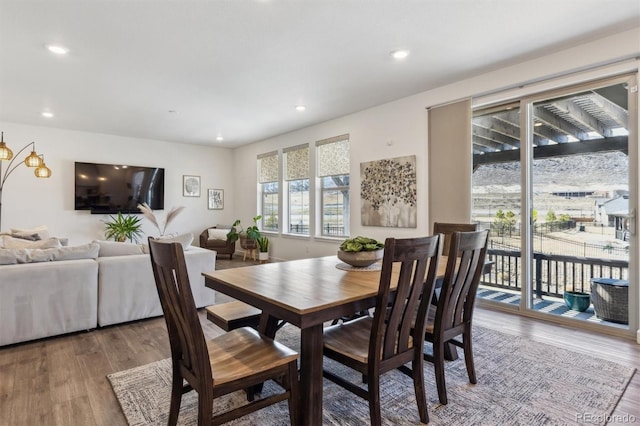 dining room with recessed lighting and wood finished floors