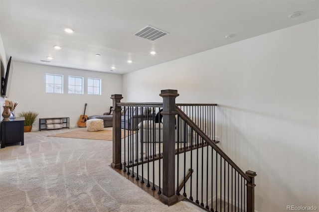 staircase featuring recessed lighting, carpet, and visible vents