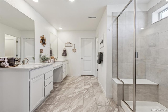 bathroom featuring visible vents, a shower stall, and vanity