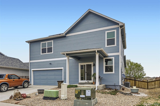 277 Jewel St, Brighton, CO 80603 - view of front of home featuring a garage, fence, central AC unit, and driveway