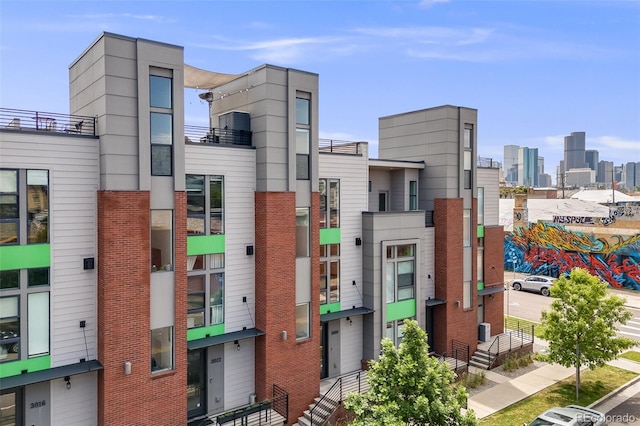 3008 Blake St, Denver, CO 80205 - view of building exterior featuring a skyline view