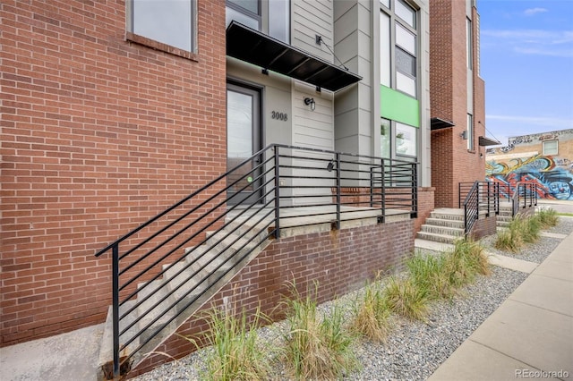 3008 Blake St, Denver, CO 80205 - view of exterior entry featuring brick siding