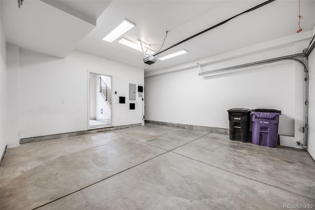 3008 Blake St, Denver, CO 80205 - garage featuring a garage door opener and electric panel