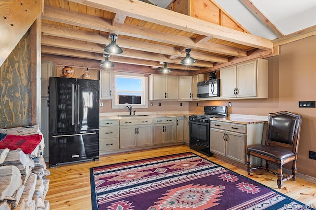 kitchen featuring black appliances, gray cabinetry, sink, light hardwood / wood-style flooring, and beam ceiling