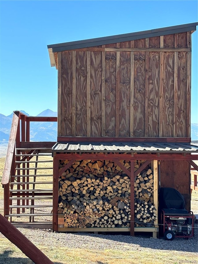 view of side of home featuring a mountain view