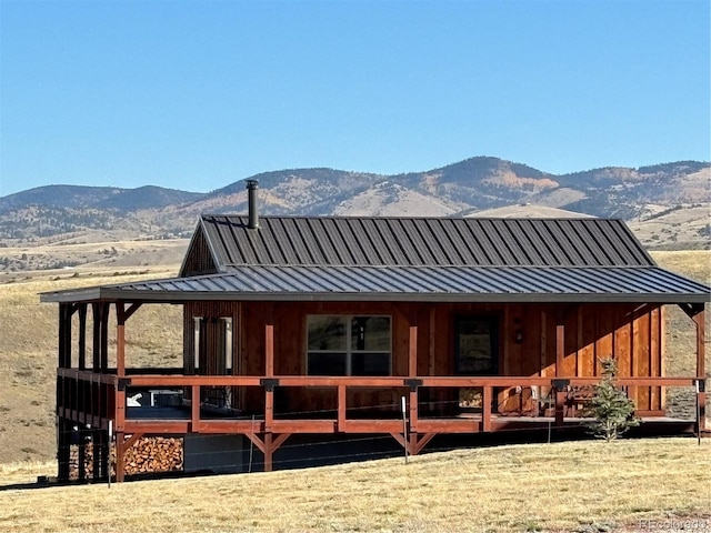 back of house featuring a mountain view