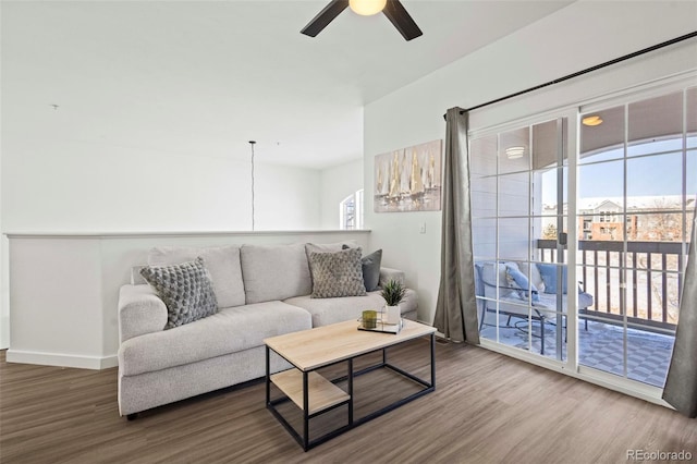 living room with hardwood / wood-style flooring, ceiling fan, and plenty of natural light