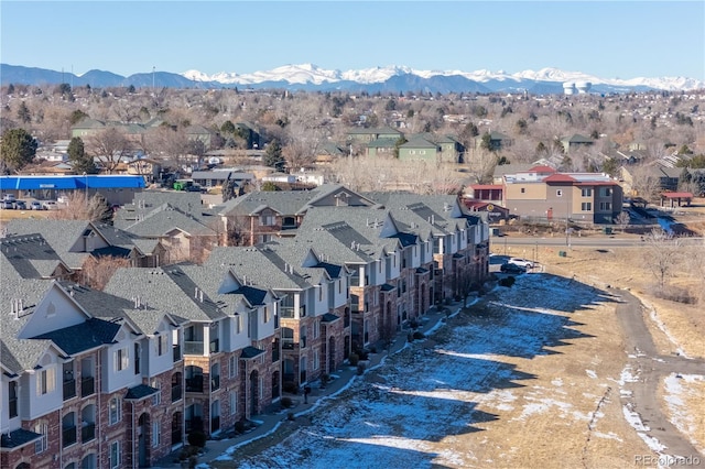 birds eye view of property with a mountain view