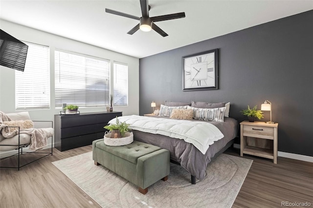 bedroom featuring ceiling fan and hardwood / wood-style floors