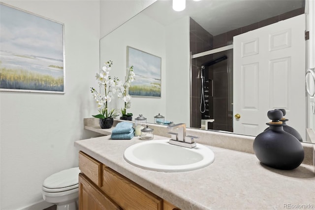 bathroom with vanity, toilet, and an enclosed shower