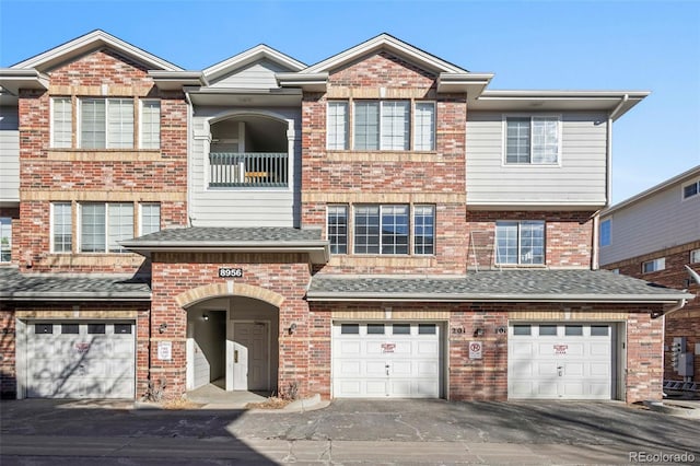 view of front of property with a garage