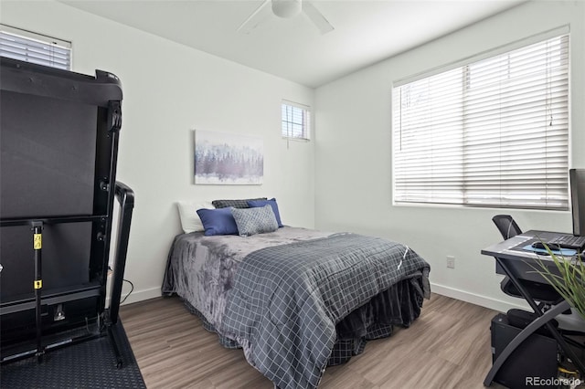 bedroom featuring ceiling fan and light hardwood / wood-style floors