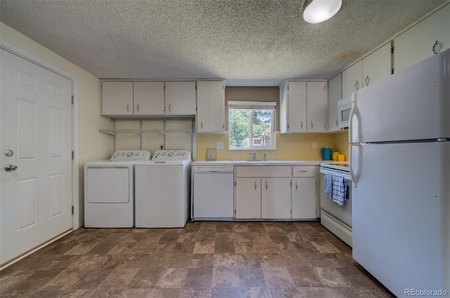 laundry area featuring tile floors and washer and dryer