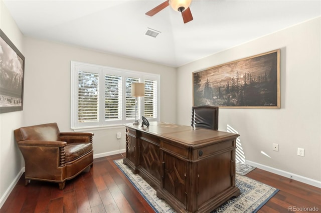 home office featuring lofted ceiling, baseboards, a ceiling fan, and dark wood-type flooring