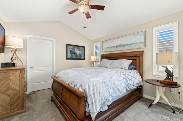 bedroom with lofted ceiling, light carpet, visible vents, and baseboards