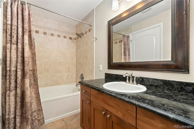 bathroom featuring shower / bath combo with shower curtain, vanity, and tile patterned floors