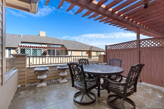 view of patio / terrace featuring outdoor dining area, fence, and a pergola