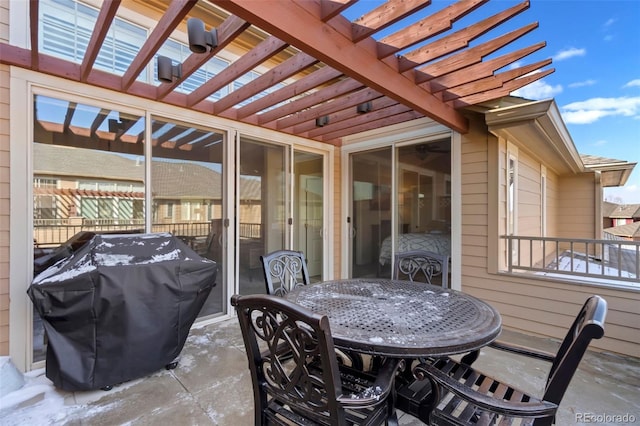 view of patio / terrace featuring outdoor dining space, a grill, and a pergola