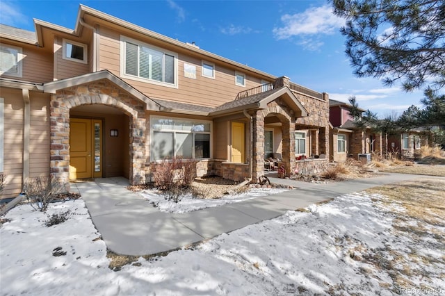 8643 Gold Peak Dr Unit E, Highlands Ranch, CO 80130 - view of front of house with stone siding