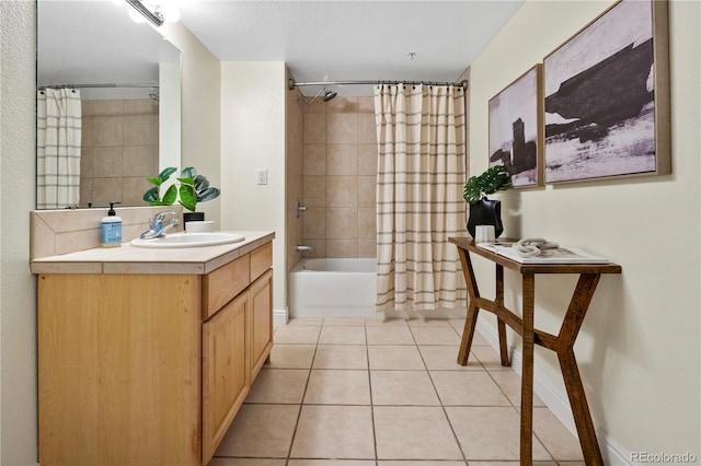 bathroom with shower / tub combo with curtain, tile patterned floors, and vanity