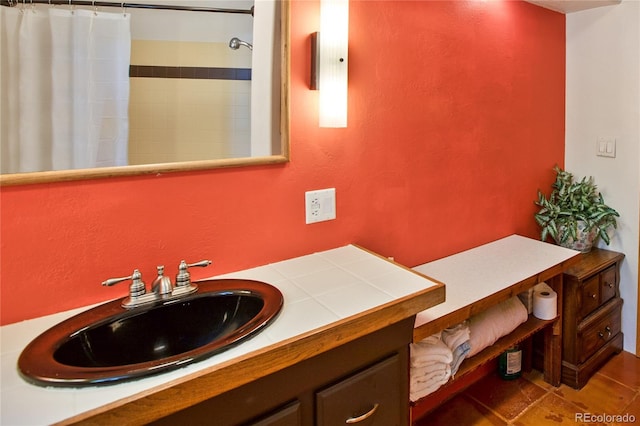 bathroom with tile flooring and vanity