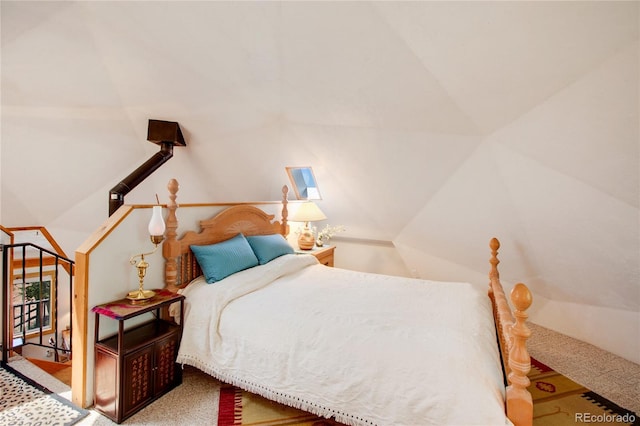 bedroom with carpet and lofted ceiling