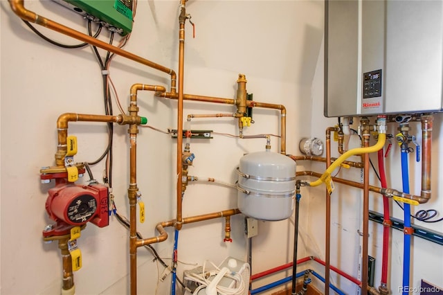 utility room featuring tankless water heater