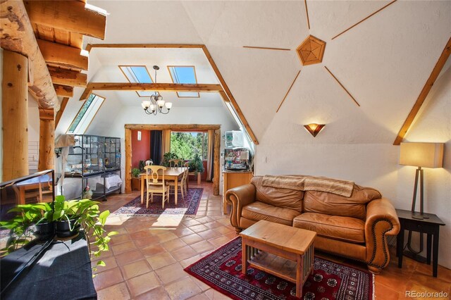 47 Aspen Rd, Woodland Park, CO 80863 - tiled living area featuring vaulted ceiling and a chandelier