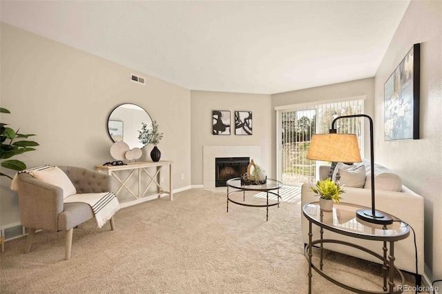 13085 W Cedar Dr Unit 114, Lakewood, CO 80228 - carpeted living area with baseboards, visible vents, and a fireplace