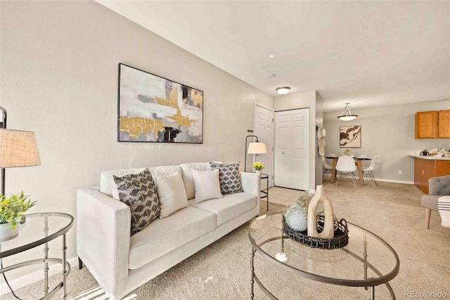 13085 W Cedar Dr Unit 114, Lakewood, CO 80228 - living area with light carpet and baseboards