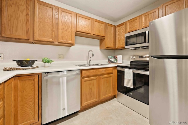 13085 W Cedar Dr Unit 114, Lakewood, CO 80228 - kitchen featuring light countertops, a sink, and stainless steel appliances