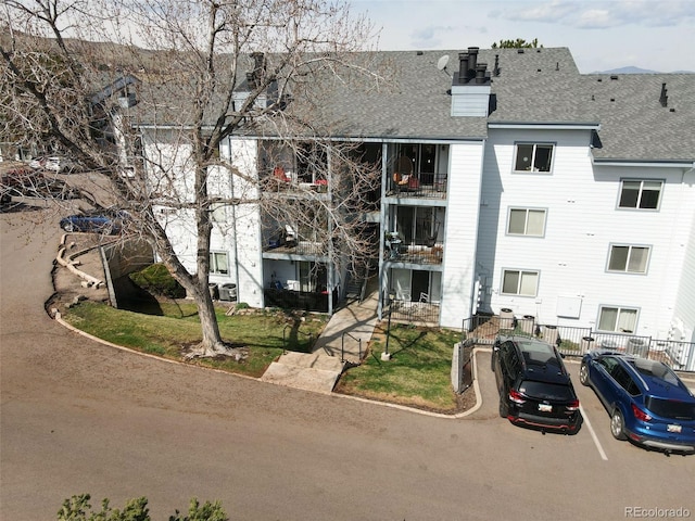 13085 W Cedar Dr Unit 114, Lakewood, CO 80228 - view of building exterior with fence