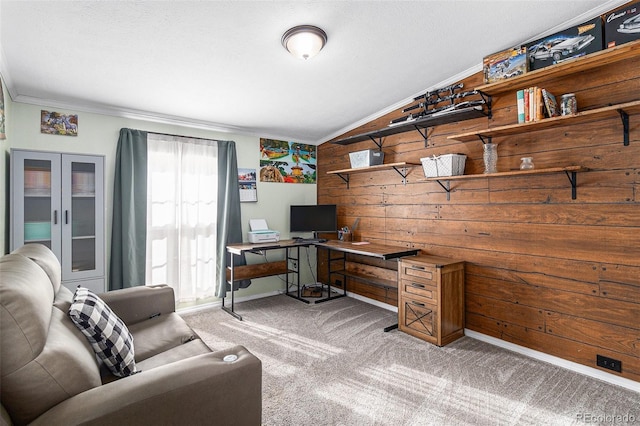 carpeted office space featuring lofted ceiling, french doors, wood walls, and crown molding