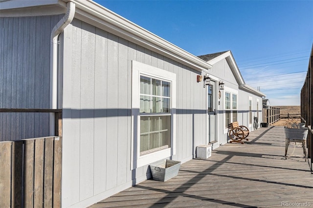 view of side of property with a deck