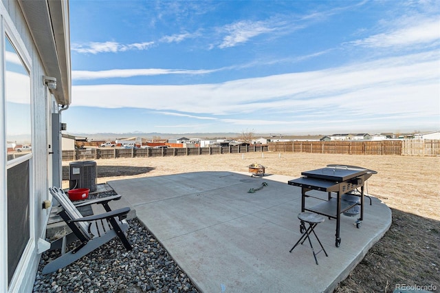 view of patio featuring a fenced backyard and cooling unit