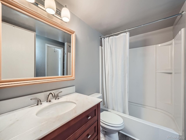 full bathroom featuring vanity, toilet, and shower / tub combo with curtain