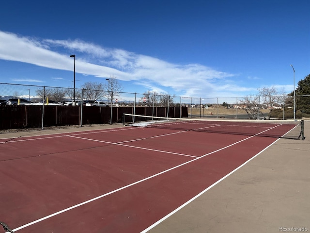 view of sport court featuring community basketball court and fence