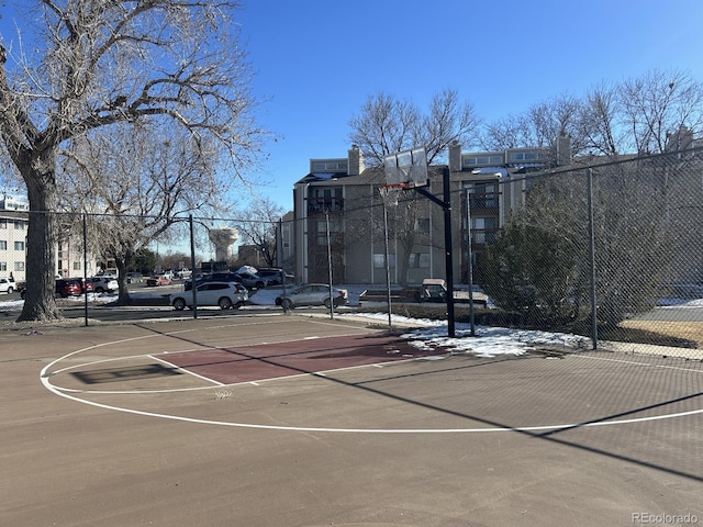 view of basketball court featuring community basketball court and fence