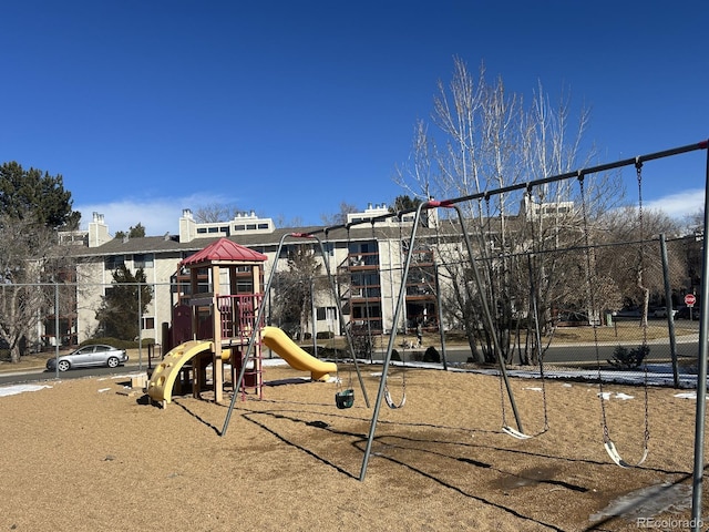 community jungle gym featuring fence